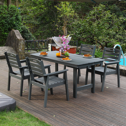 HDPE outdoor dining set with table and four dark gray slatted chairs on a wooden deck on Tampa Home & Garden Store