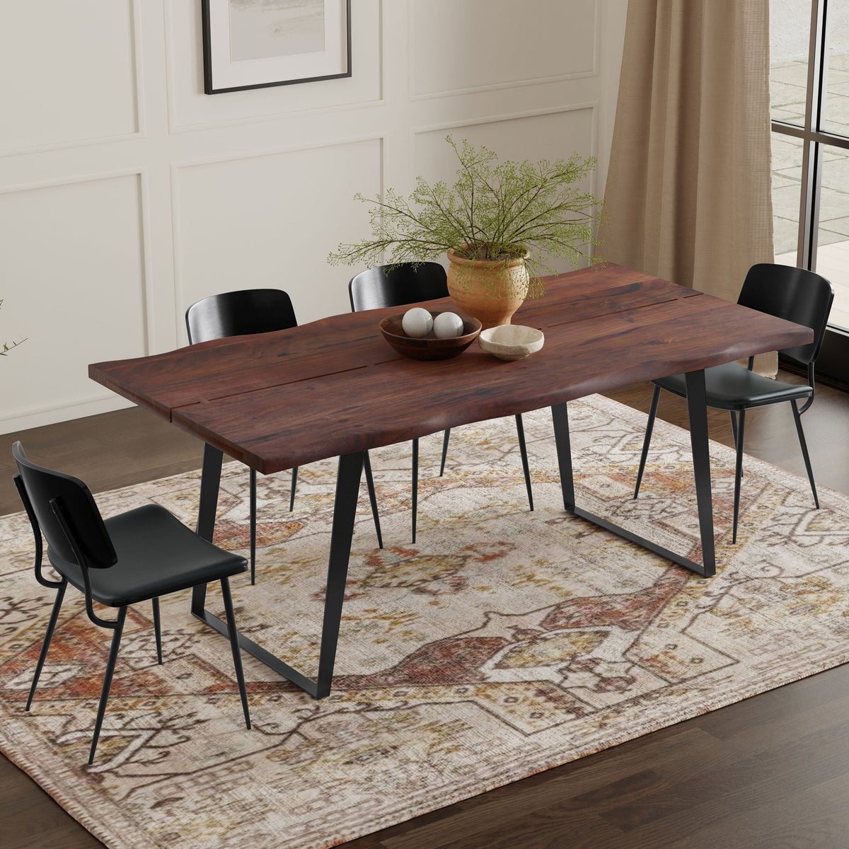 Modern Handcrafted Live Edge Acacia Dining Table with black metal legs in a paneled dining room on Tampa Home & Garden Store