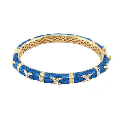 Elegant Hugs Bangle — Wide Pavé X blue enamel gold-tone bracelet with crystal cross accents on Tampa Home & Garden Store