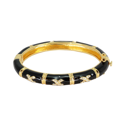 Elegant Hugs Bangle Slim Pavé X bracelet, black enamel with gold-tone accents on Tampa Home & Garden Store
