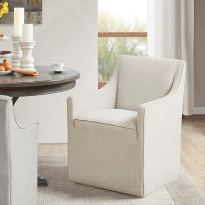 Traditional skirted dining arm chairs by HouseOfZazla in beige fabric with hidden casters on Tampa Home & Garden Store