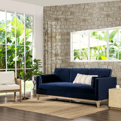 Knox Modern Farmhouse Sofa blue velvet stationary sofa with wood legs beside beige accent chair on Tampa Home & Garden Store