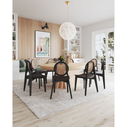 Rattan cane backrest dining chair set with solid wood frame in black around a round wood table on Tampa Home & Garden Store