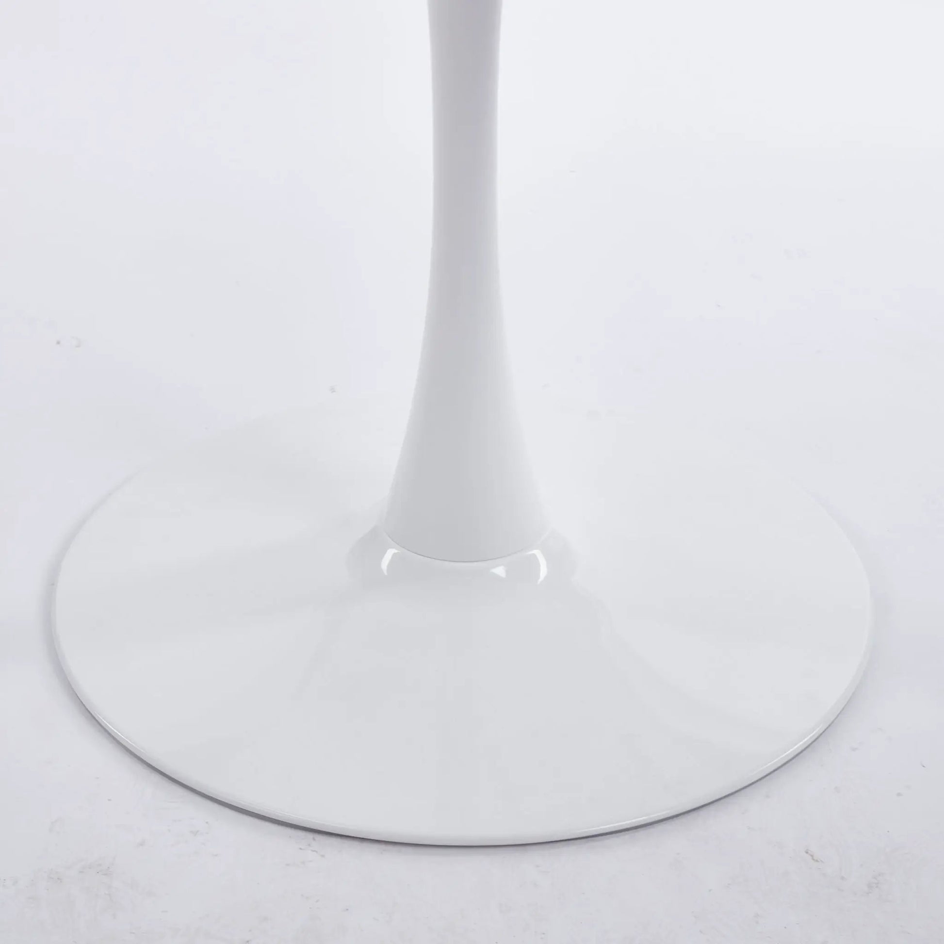 Mid-Century Tulip dining table with round white top and slender pedestal base on Tampa Home & Garden Store