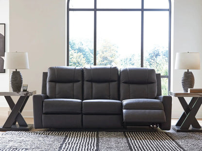 Mackmenville reclining sofa in dark leather by Unique Piece Furniture with end tables and lamps on Tampa Home & Garden Store