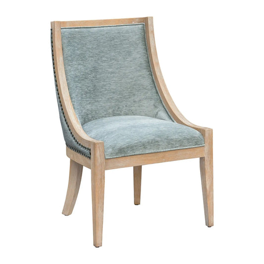 Upholstered dining chair with nailhead trim, blue-gray fabric and light wood frame on Tampa Home & Garden Store
