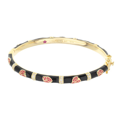 Lady Poof Stackable Bangle by Lauren G Adams, gold-tone bracelet with black enamel segments on Tampa Home & Garden Store