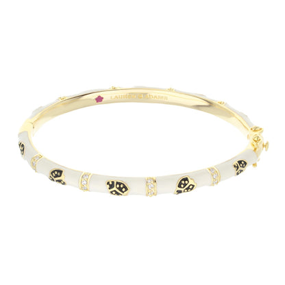 Lady Poof Stackable Bangle, Lauren G Adams gold bracelet with white enamel skull motifs on Tampa Home & Garden Store