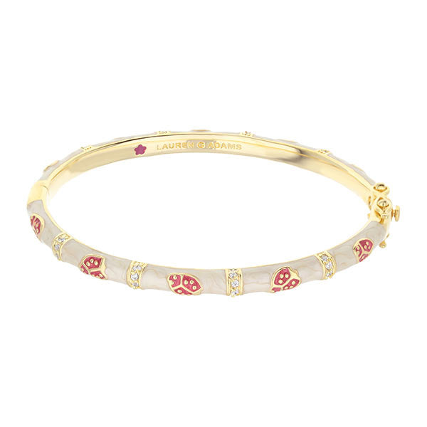 Lady Poof Stackable Bangle by Lauren G Adams, gold-tone bracelet with white enamel and red accents on Tampa Home & Garden Store