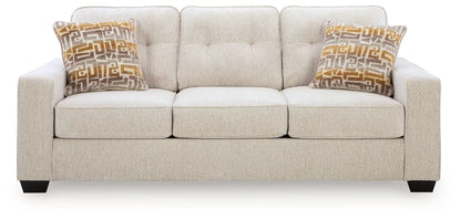 Larimer sofa beige stationary sofa with tufted back and two geometric orange pillows on Tampa Home & Garden Store