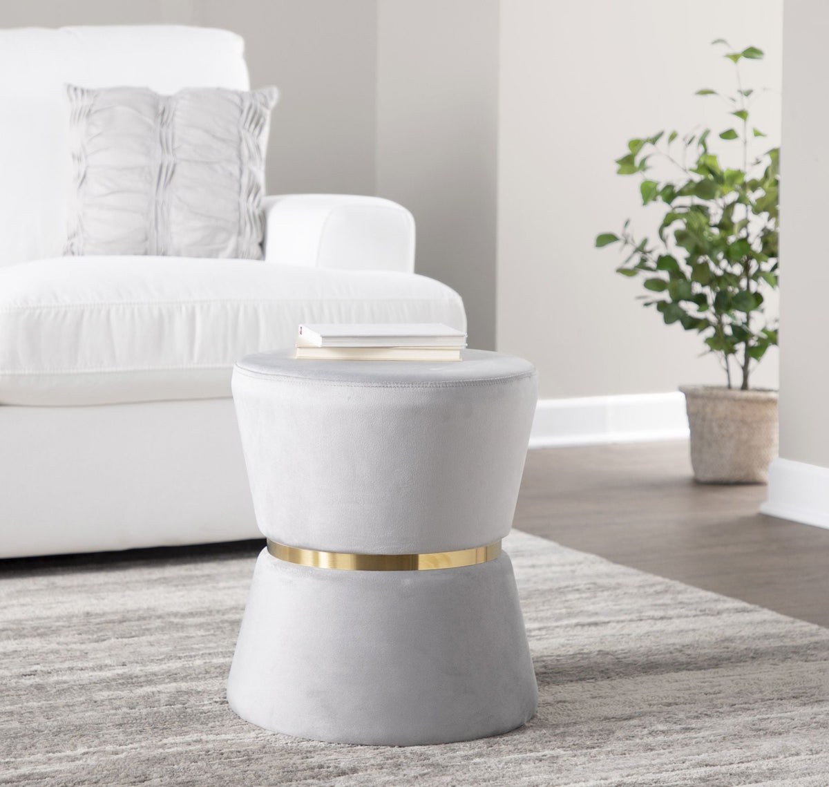 Contemporary glam ottoman with silver-gray velvet upholstery and a gold metal band base on Tampa Home & Garden Store