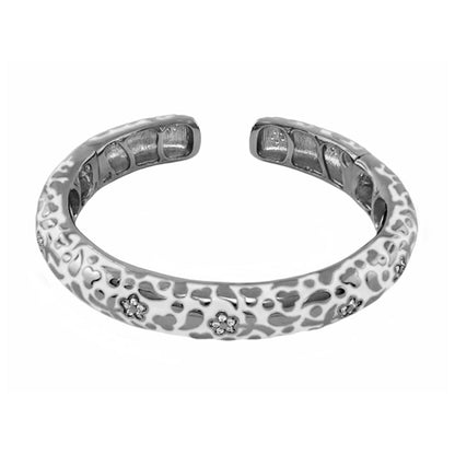 Hinged silver bangle with slim pavé blossom cutouts by Lauren G Adams on Tampa Home & Garden Store