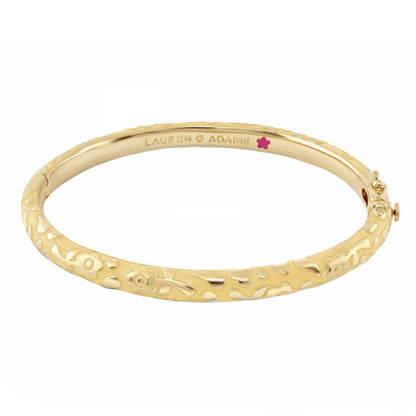 Gold tone Flowers by Orly stackable bangle with floral engraving and Lauren G Adams branding on Tampa Home & Garden Store