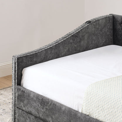 Upholstered daybed frame in gray faux leather with nailhead trim on Tampa Home & Garden Store