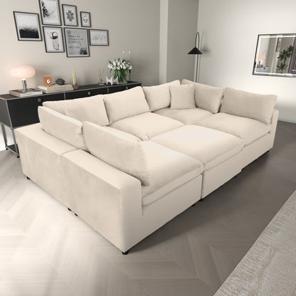 Hayward ivory modular sectional sofa with black legs in a modern living room on Tampa Home & Garden Store