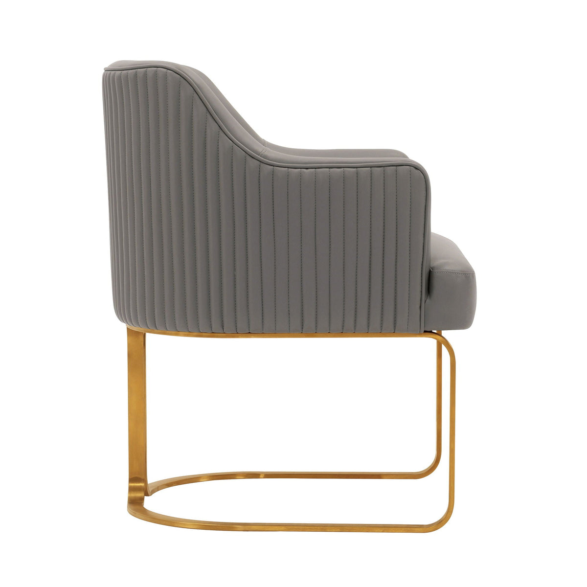 Arm chair with dark gray quilted upholstery and solid wood frame with brass legs on Tampa Home & Garden Store