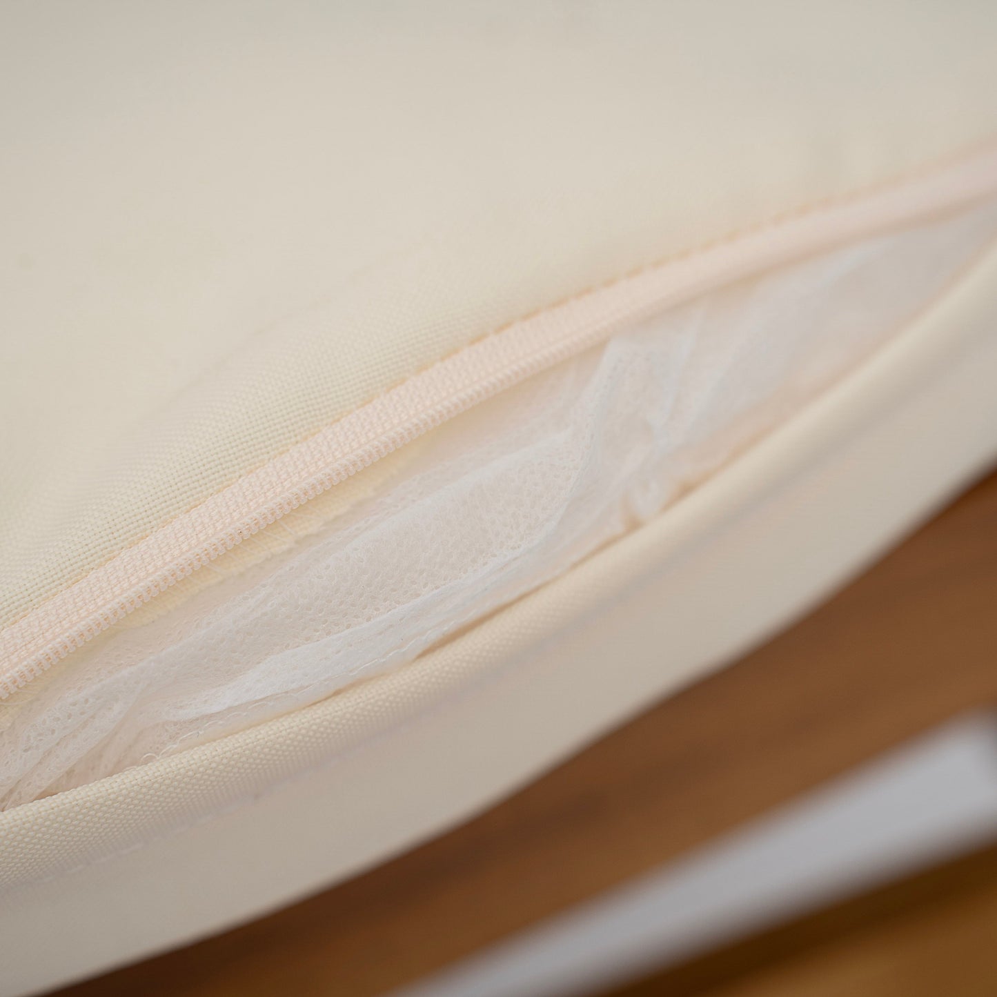 Beige fabric close-up with woven texture and stitched seam on Tampa Home & Garden Store