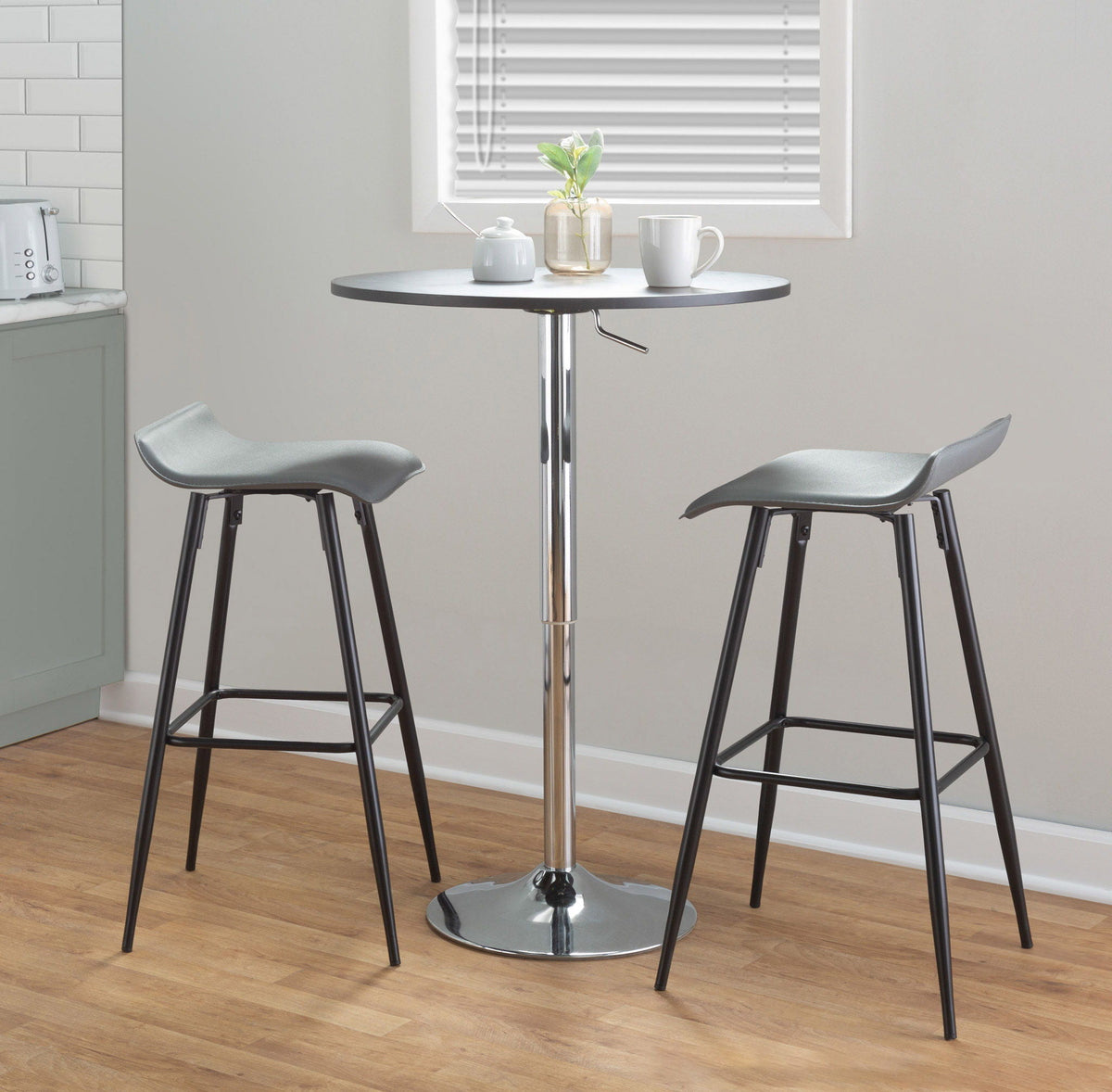 Contemporary adjustable bar table with hydraulic lift and round black top; two stools on Tampa Home & Garden Store
