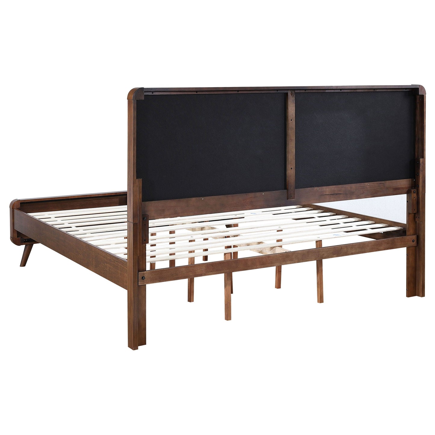Carson Carrington platform bed with dark upholstered headboard panels and wood frame on Tampa Home & Garden Store