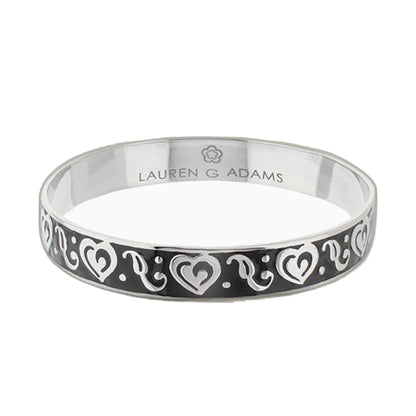 Hidden Hearts Slip-On Bangle by Lauren G Adams, black band with white scroll-heart motif on Tampa Home & Garden Store