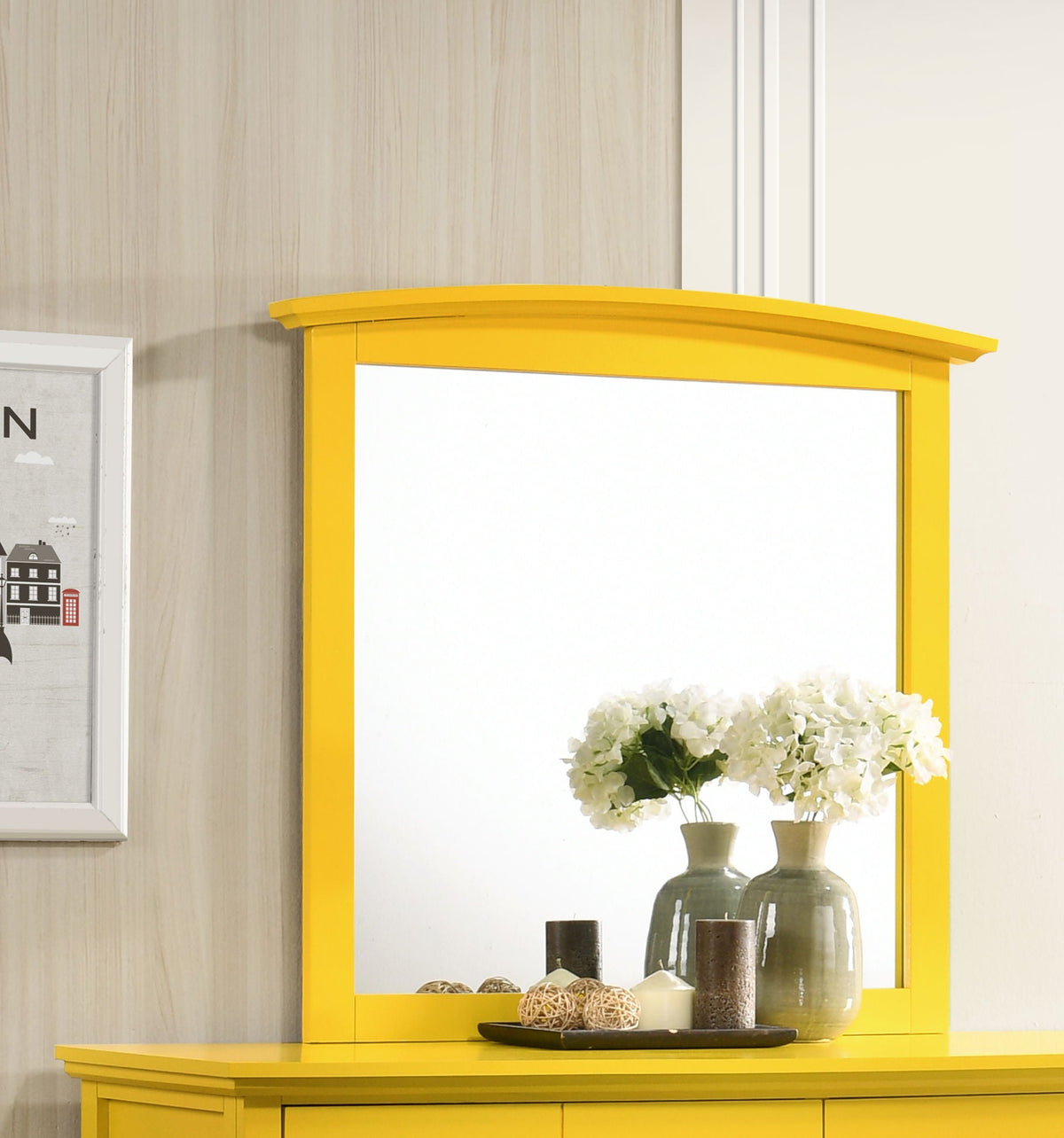 Wall mirror with bright yellow frame and curved top; hydrangea arrangement on display on Tampa Home & Garden Store