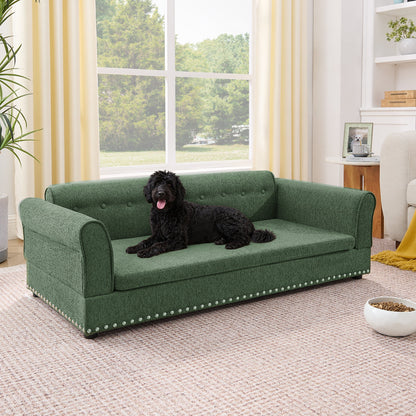 Oversized pet sofa in green textured fabric with nailhead trim; dog lounging on Tampa Home & Garden Store