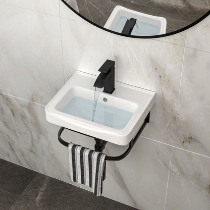 Wall mounted vanity sink with black matte faucet, white basin and overflow on marble wall on Tampa Home & Garden Store