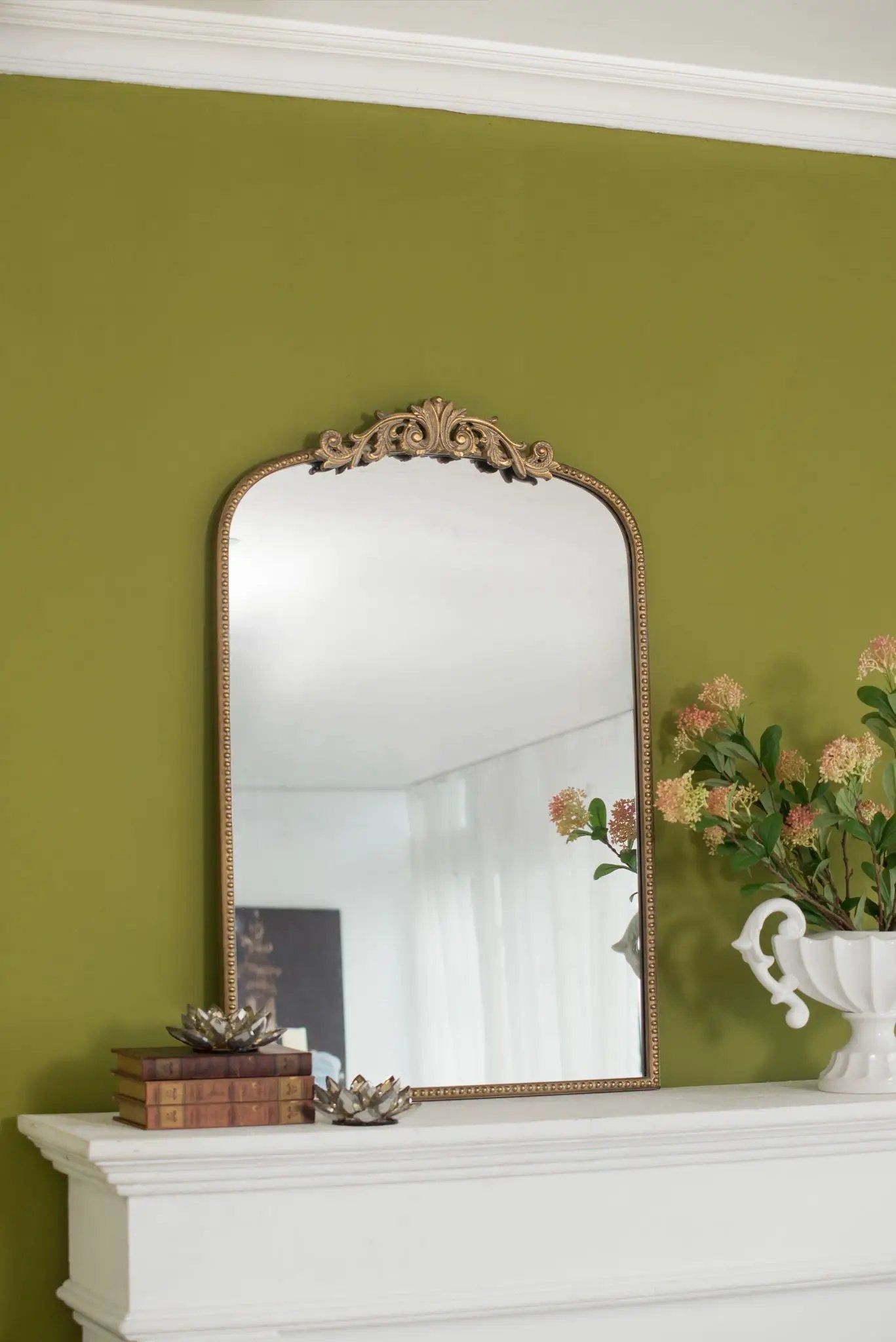 Arch Mirror with ornate gold Baroque frame and arched top above a white mantle on olive wall on Tampa Home & Garden Store