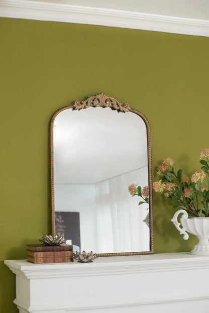 Arch Mirror with ornate gold Baroque frame and arched top above a white mantle on olive wall on Tampa Home & Garden Store