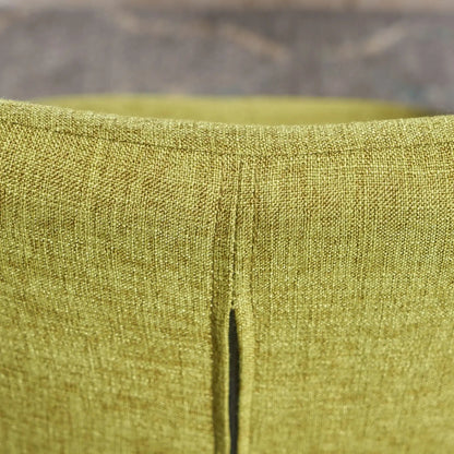 Arm chair upholstery close-up in olive-gold textured fabric with seam on Tampa Home & Garden Store