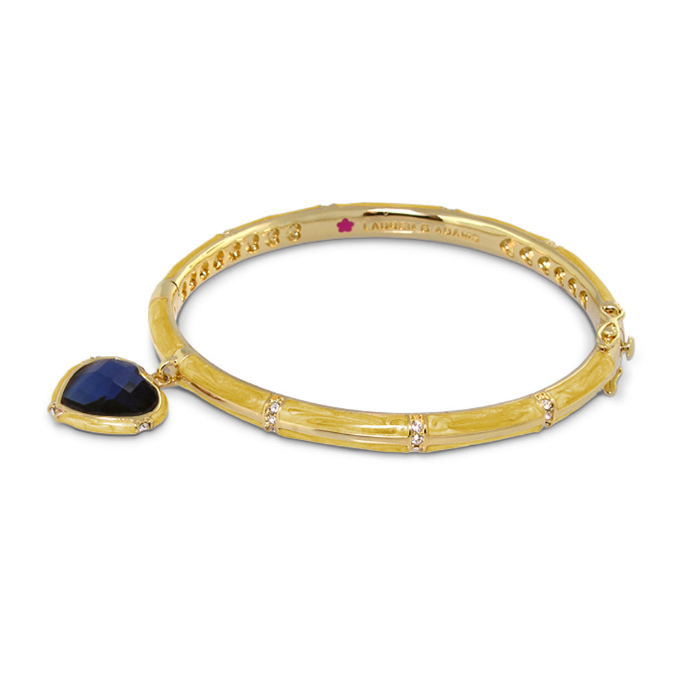 Prince Charming Heart Bangle by Lauren G Adams in gold-tone with a blue faceted heart pendant on Tampa Home & Garden Store