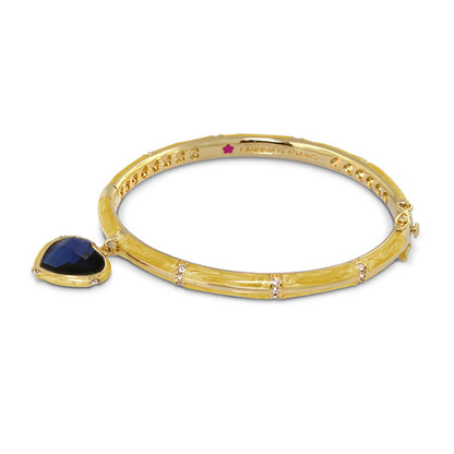 Prince Charming Heart Bangle by Lauren G Adams in gold-tone with a blue faceted heart pendant on Tampa Home & Garden Store
