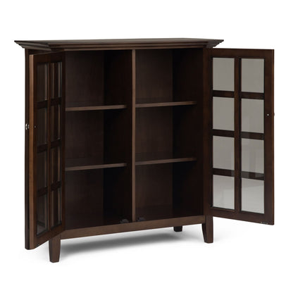 Acadian medium storage cabinet in natural aged brown with glass panel doors and open shelving on Tampa Home & Garden Store