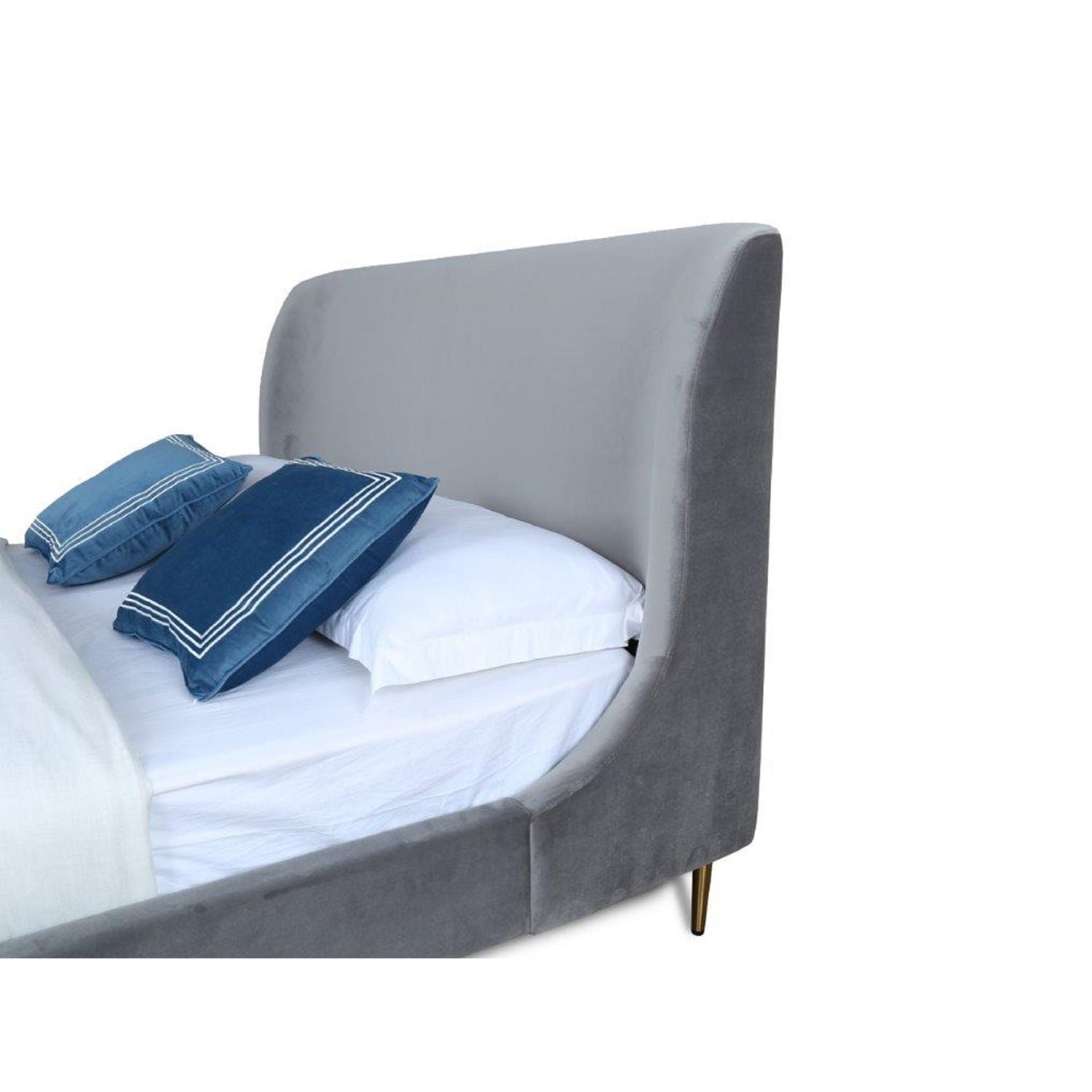 Heather upholstered bed with curved headboard and frame; white bedding with blue pillows on Tampa Home & Garden Store