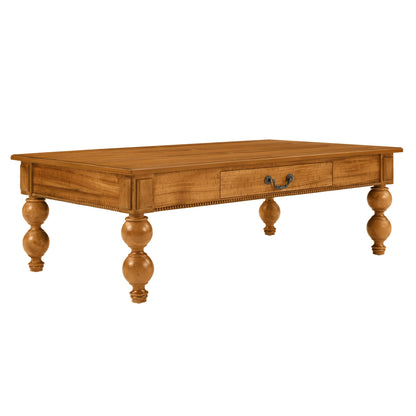Rectangular wooden coffee table with a storage drawer in warm oak finish and turned legs on Tampa Home & Garden Store
