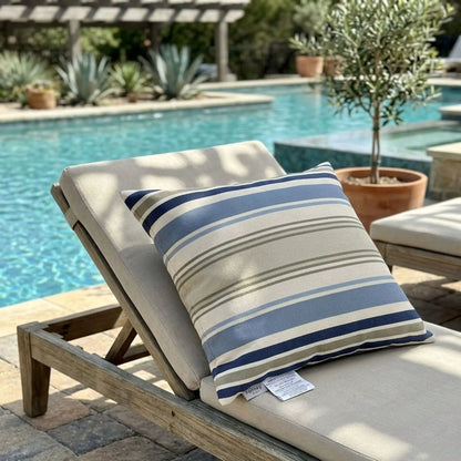 Outdoor Pillows set of 2 featuring blue and gray striped covers on a wooden lounge chair by the pool on Tampa Home & Garden Store