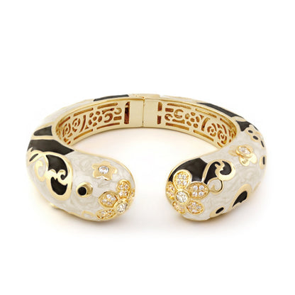 Daisy Swirl Bangle, gold-tone enamel bracelet with black swirls and crystal daisies on Tampa Home & Garden Store