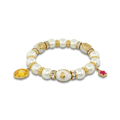 Daisy Swirl Bracelet by Lauren G Adams with white pearl beads, gold spacers, two charms on Tampa Home & Garden Store