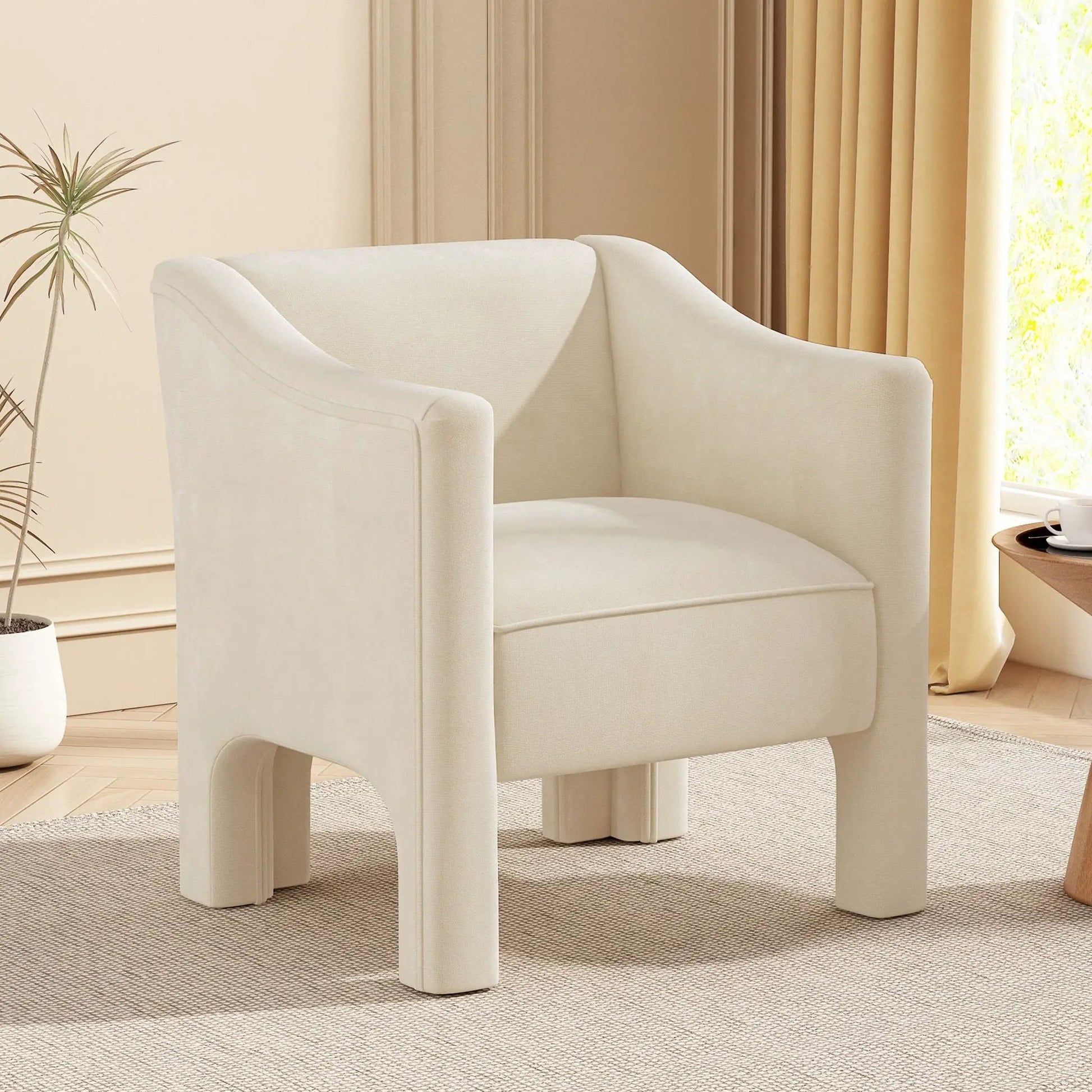 Two white fabric barrel accent chairs with enclosed arms in a bright living room on Tampa Home & Garden Store