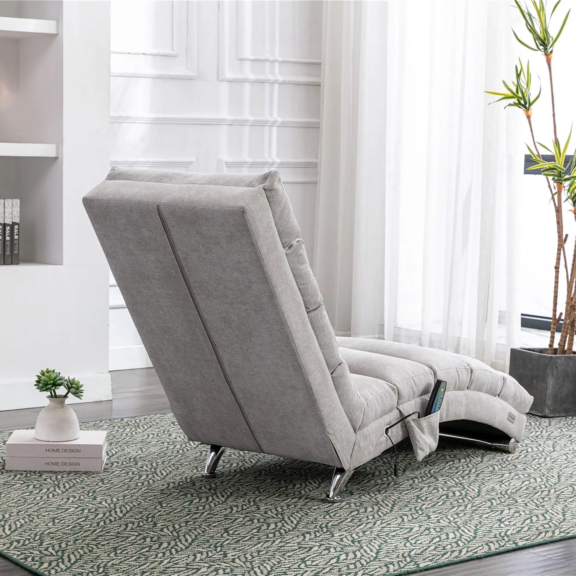 Gray massage chaise lounge with remote control, ergonomic electric massager, modern home seating on Tampa Home & Garden Store