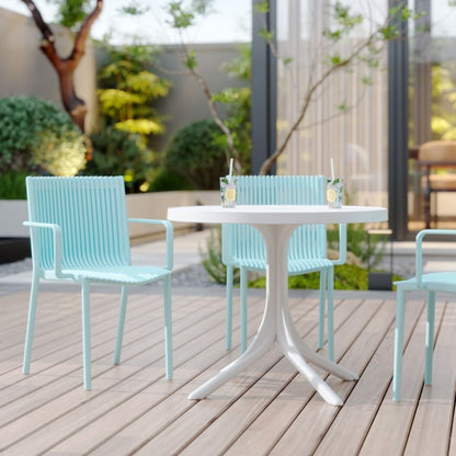 4 Stackable Plastic Chairs and Round Table