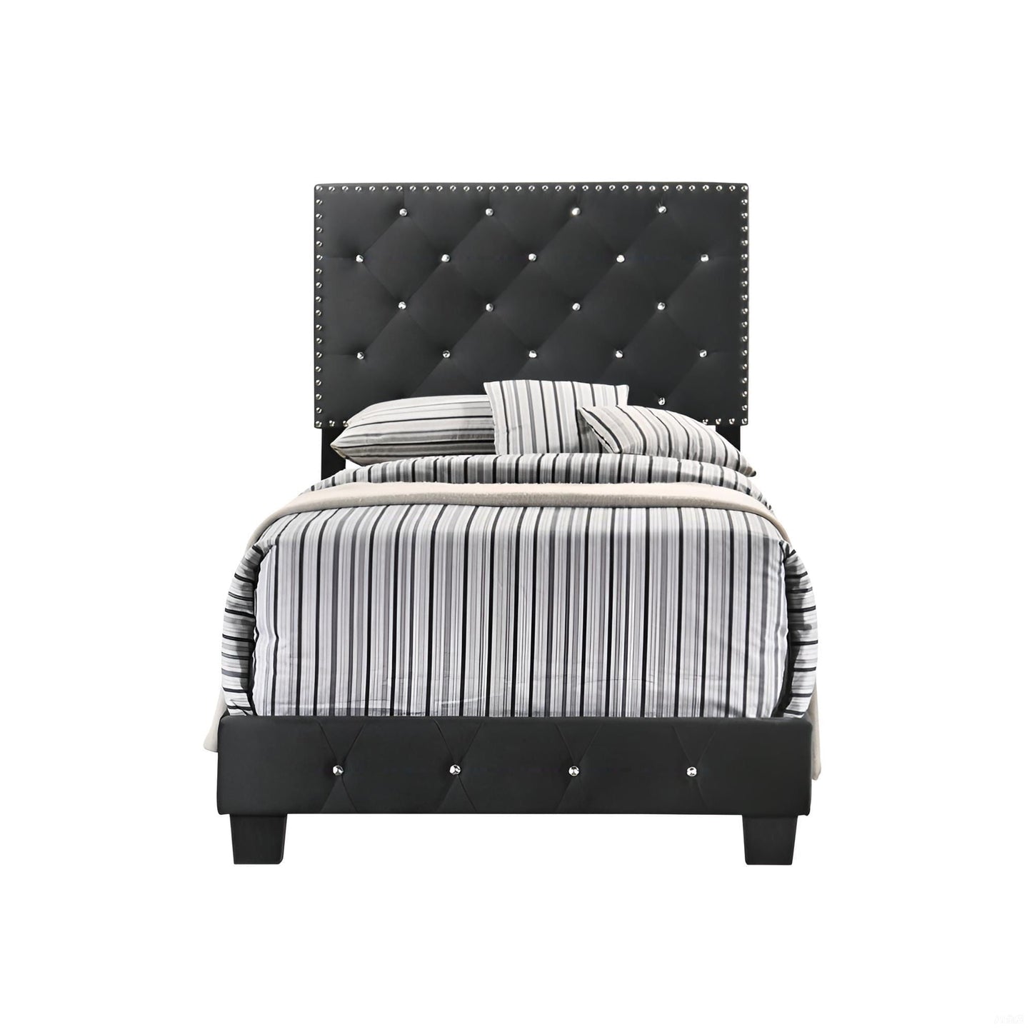Upholstered bed with a black tufted headboard, crystal studded edges, and striped gray bedding on Tampa Home & Garden Store