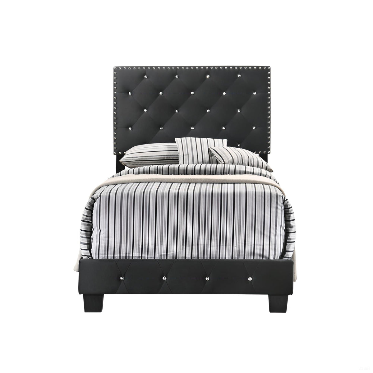 Upholstered bed with a black tufted headboard, crystal studded edges, and striped gray bedding on Tampa Home & Garden Store