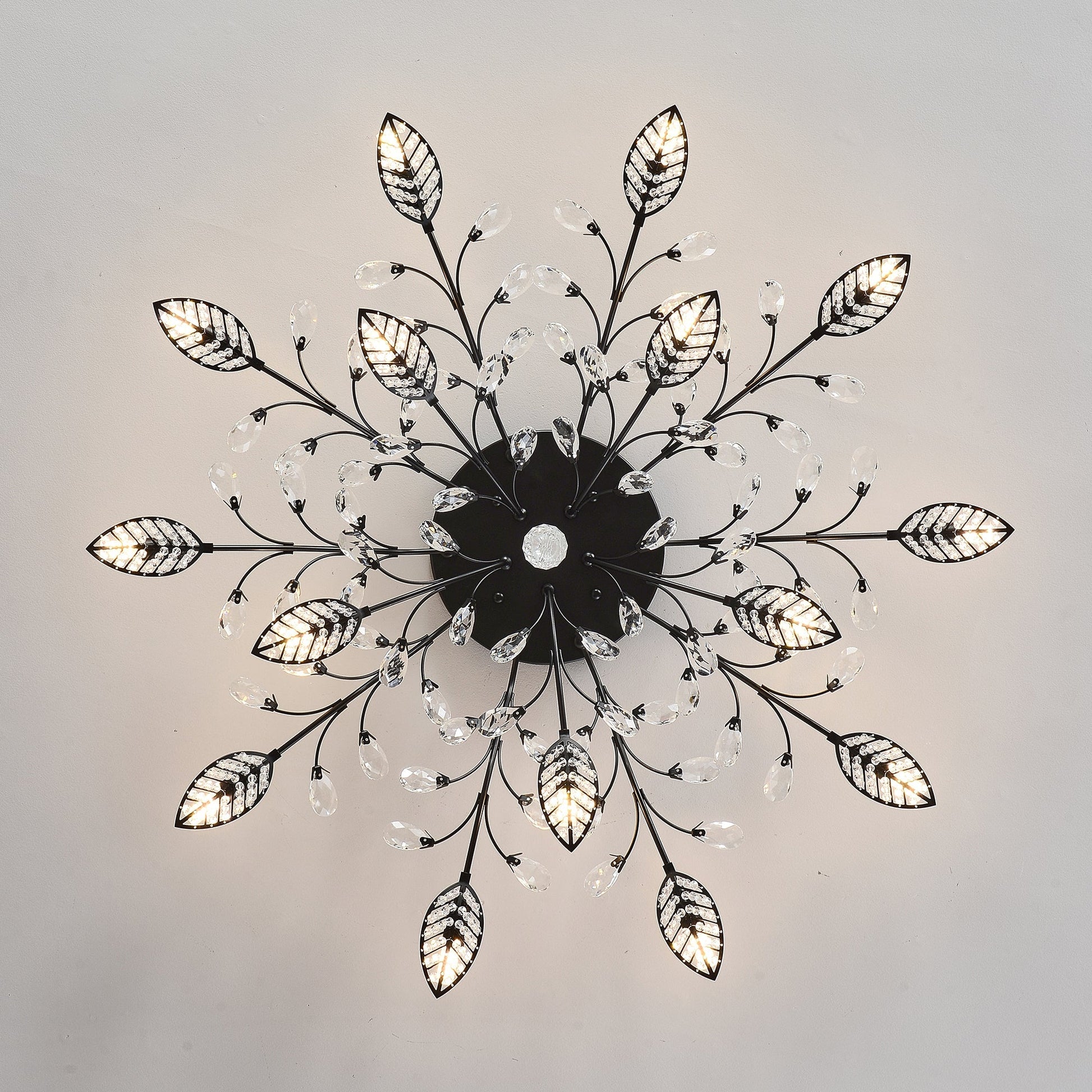 15-Light Crystal Leaf Chandelier with black metal sunburst arms and hanging drops on Tampa Home & Garden Store