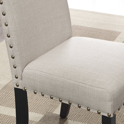 Espresso wood dining chair with tan fabric upholstery, nailhead trim and black legs on Tampa Home & Garden Store
