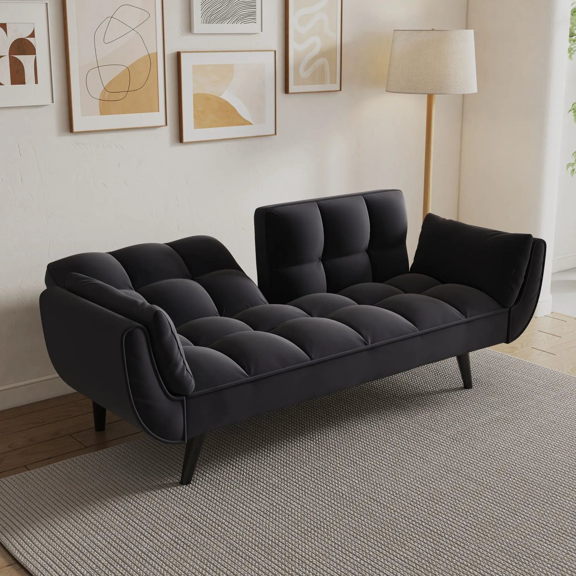 Futon sofa black faux-leather with tufted cushions and two armrests on Tampa Home & Garden Store