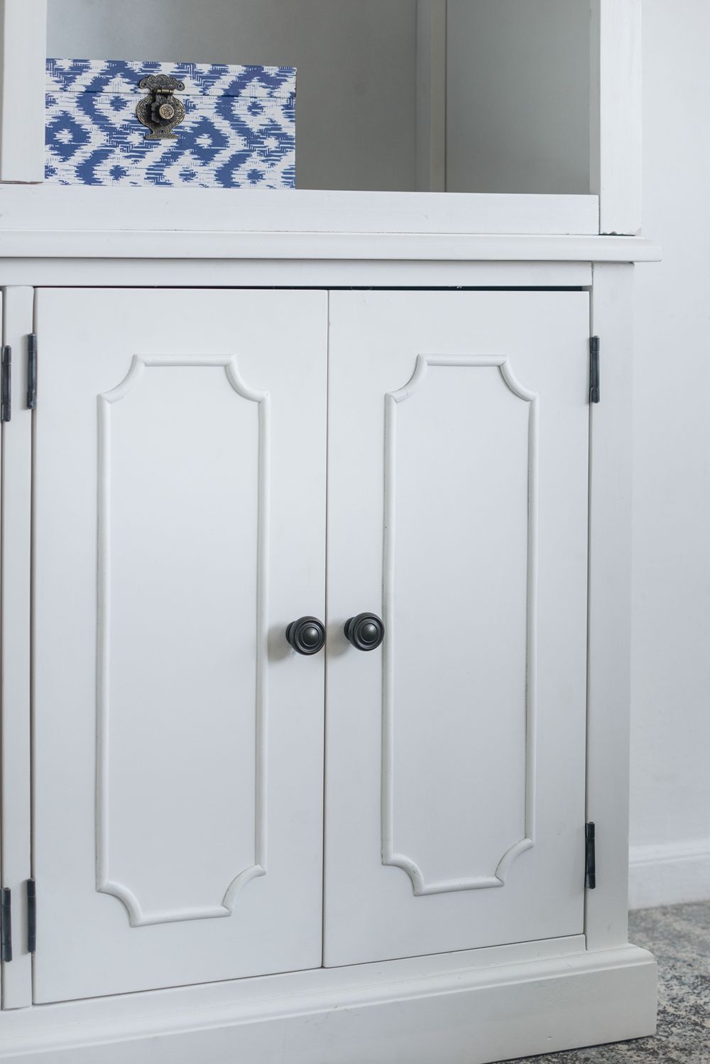 French Country Acacia Bookcase, white two-door cabinet with black knobs on Tampa Home & Garden Store