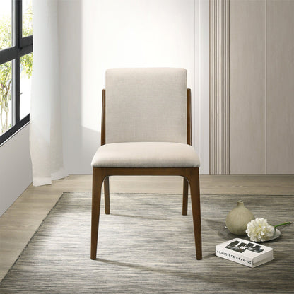 Beige upholstered dining chair by HouseOfZazla with wooden legs on Tampa Home & Garden Store