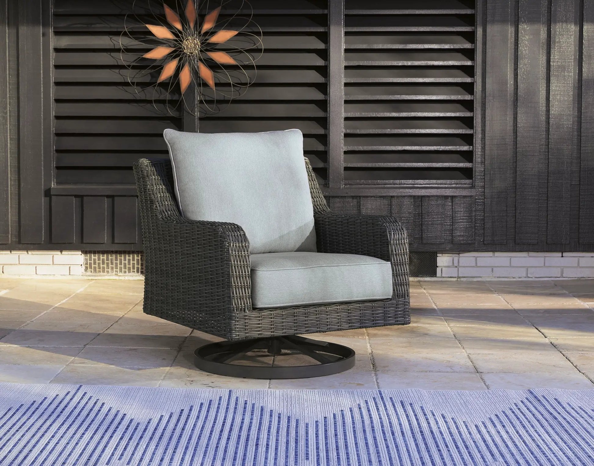 Elite Park Swivel Lounge Chair with gray cushion in dark wicker for outdoor patio seating on Tampa Home & Garden Store