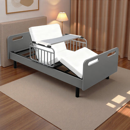 Electric adjustable hospital bed with gray frame and white mattress in a bedroom on Tampa Home & Garden Store
